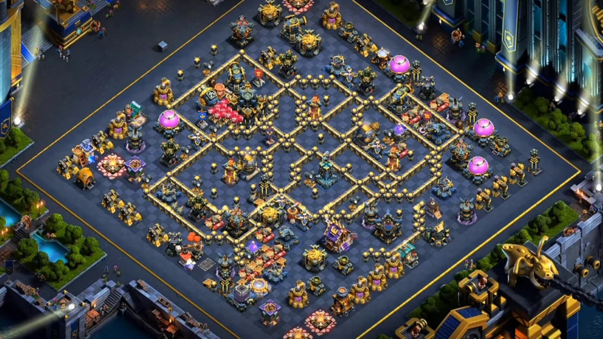 Top-down view of a TH17 war base layout in ranked mode showing the symmetric compartmentalized design with centralized Town Hall and spread defenses