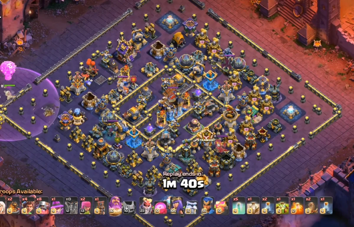 TH18 War Base layout with symmetric compartmentalized design, centralized Town Hall, Multi-Inferno triangle, and split Scattershot placement for Root Rider Yeti defense